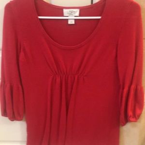 Red 3/4 length sweater.